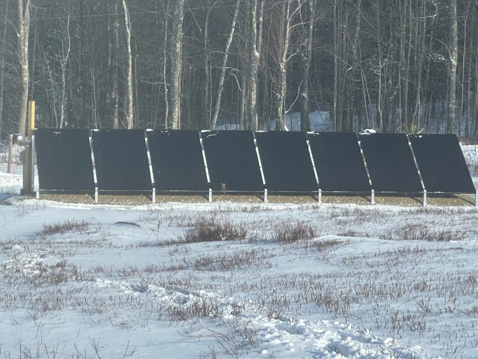 This is what each of our 4 ground mount strings look like. I used IntegraRack to mount these because we have so much ledge (surface bedrock). I like the IntegraRack system but it does require some snow clearing, including snow that can quickly accumulate at the base.